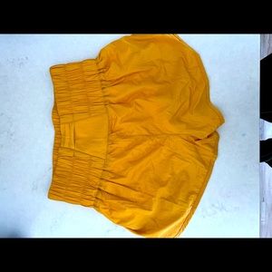 Free people movement shorts size medium in gold